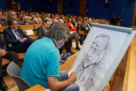 Idígoras dibuja a Pablo Hernández de Cos durante su conferencia en la Facultad de Ciencias Económicas y Empresariales de la Universidad de Málaga. Paraninfo. Octubre de 2022